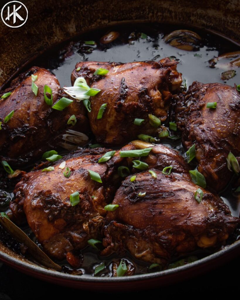 cast iron pan with chicken adobo