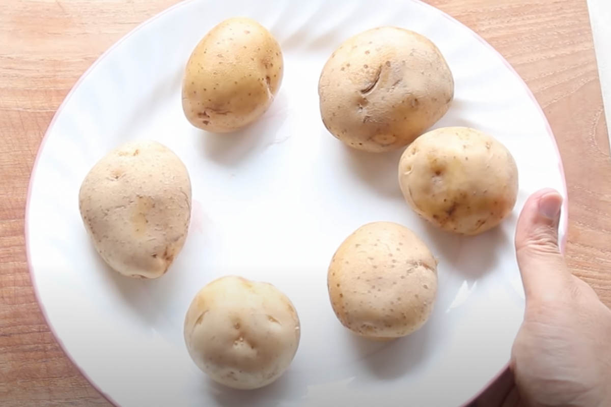 Six potatoes on a plate