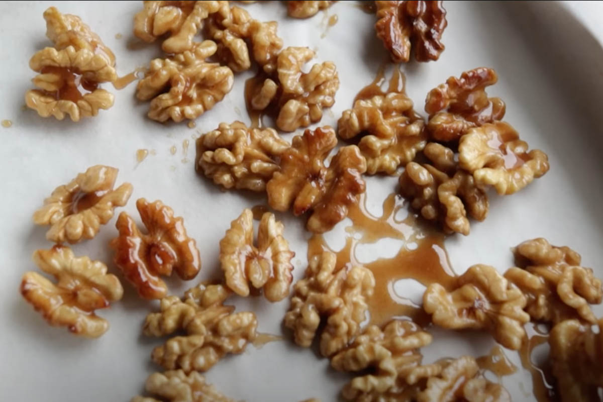 Honey walnuts on a baking tray
