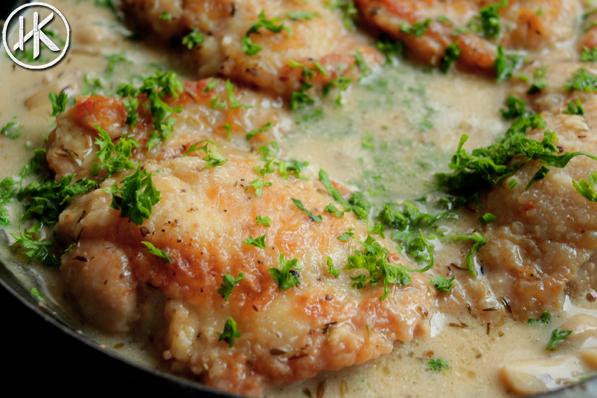 Chicken Fricassee in a pot with fresh parsley