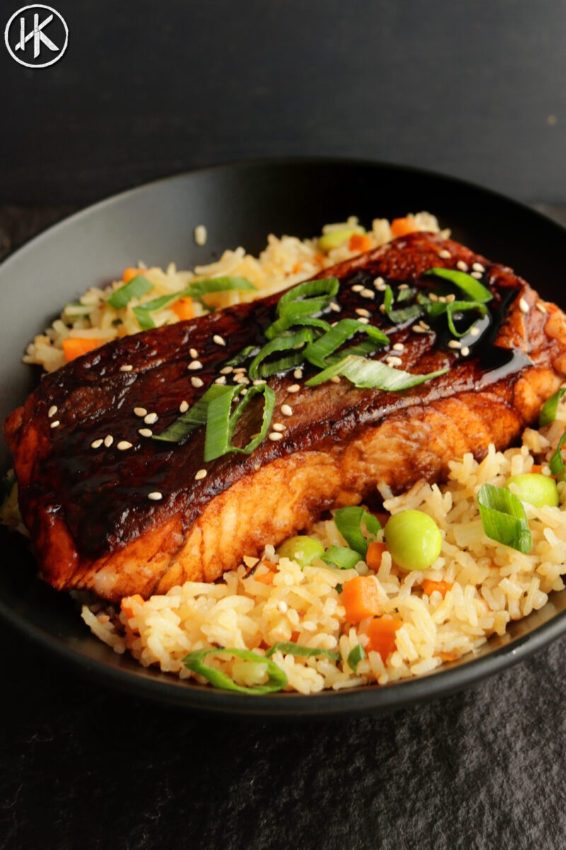 Salmon teriyaki with fried rice on a kitchen counter