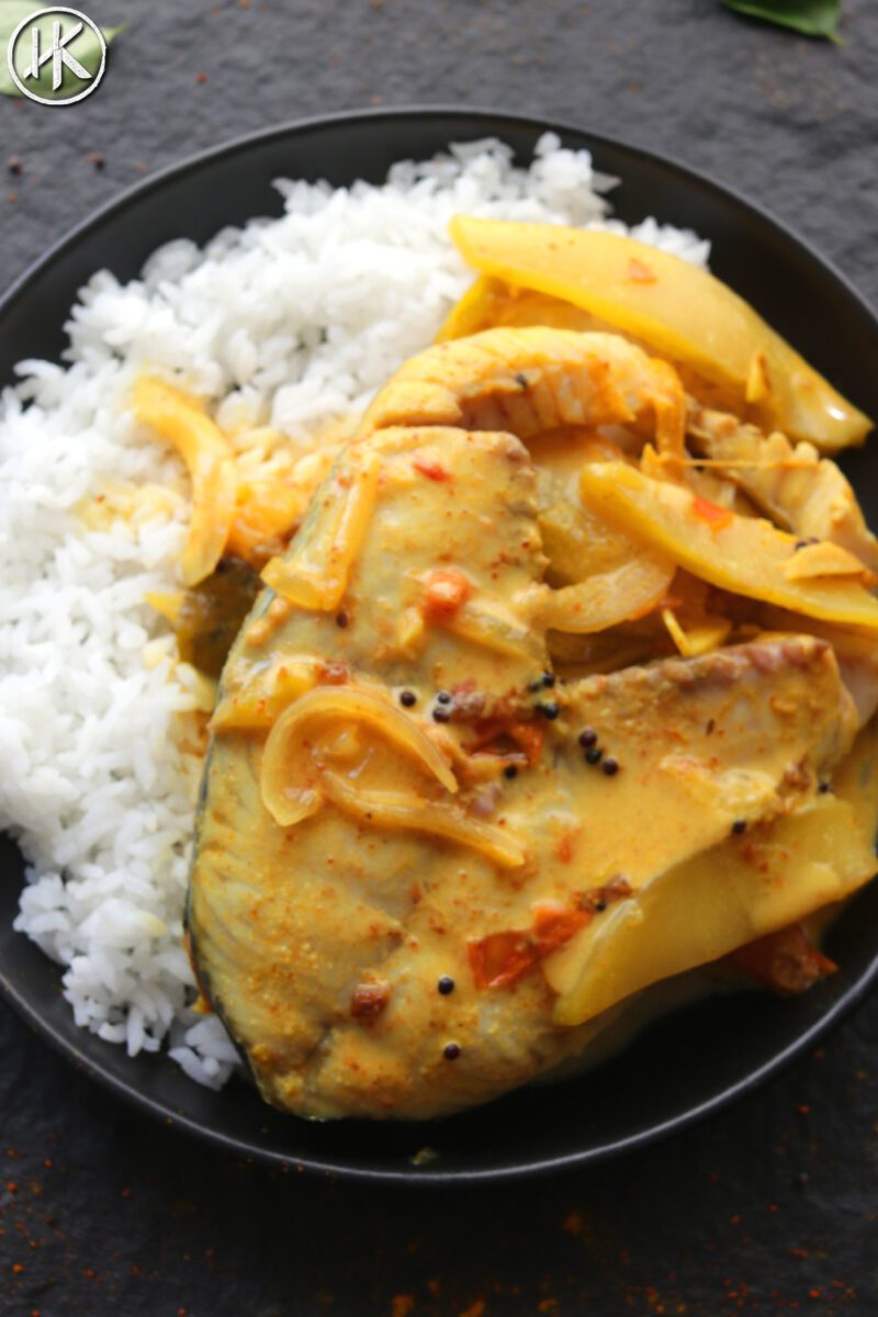 Mango fish curry on a plate with rice.