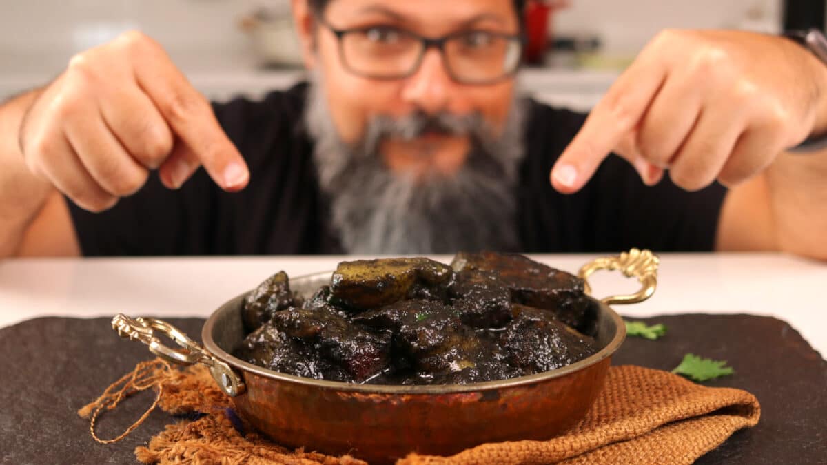 Sahil making the black sesame pork (Dohneiiong).