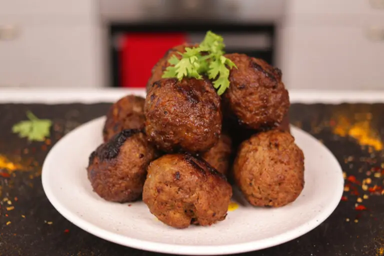 Indian Spiced Ground Beef Meatballs (Dohshaiñ) on a plate.