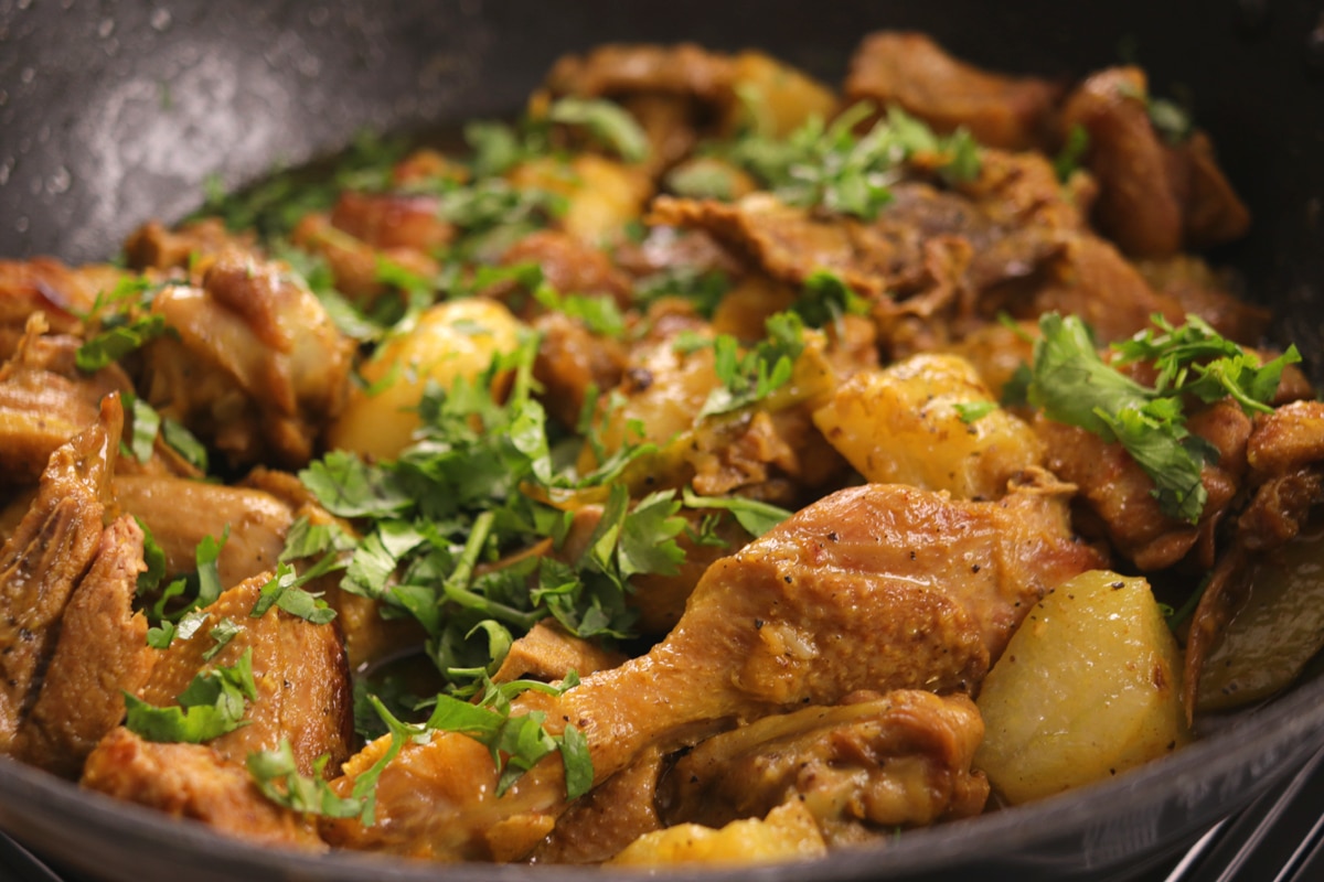 Indian Duck Curry in a pot with coriander